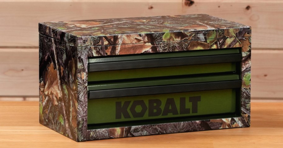 a green camo print mini Kobalt toolbox on wood table