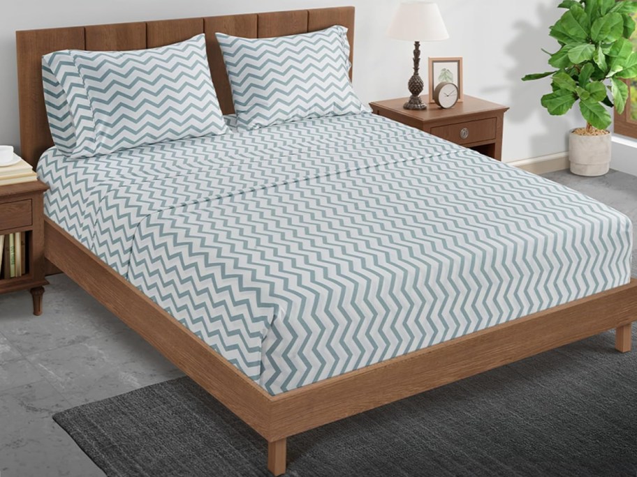 striped blue sheet set on bed