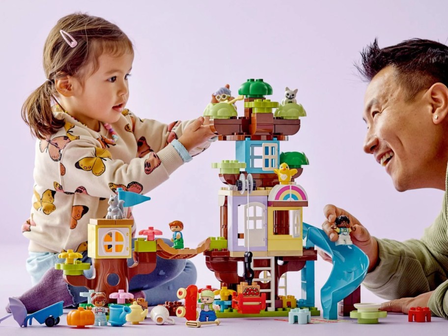 girl & man building with LEGO DUPLO bricks