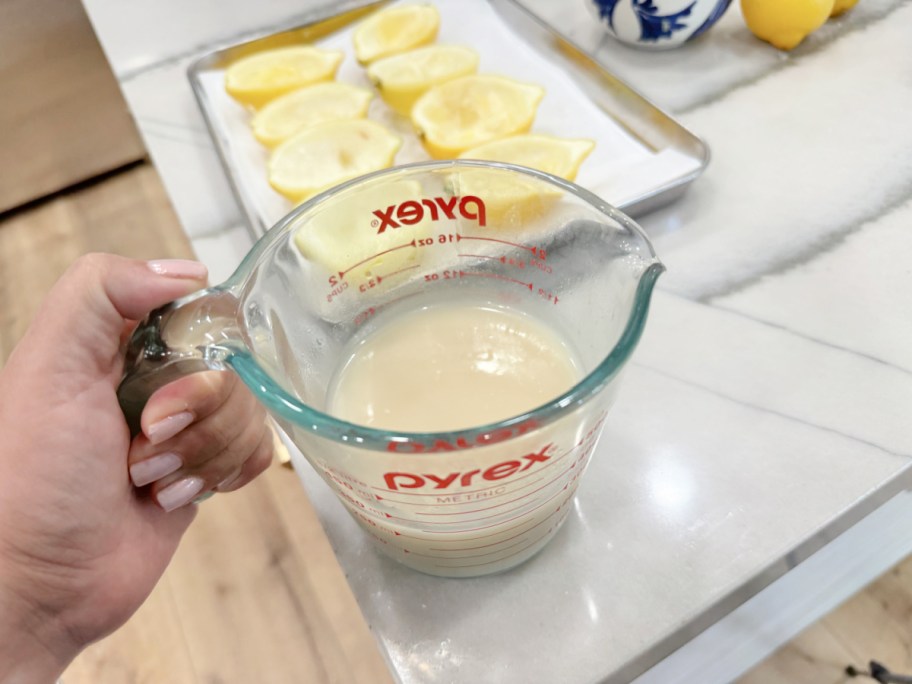 lemon sorbet in liquid measuring pyrex cup