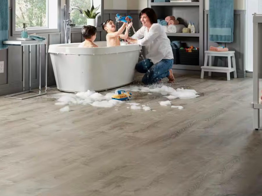 gray vinyl flooring with bathtub in background