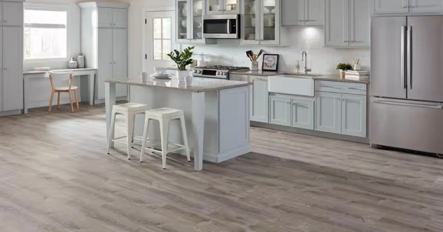 gray vinyl flooring with in kitchen with white cabinets