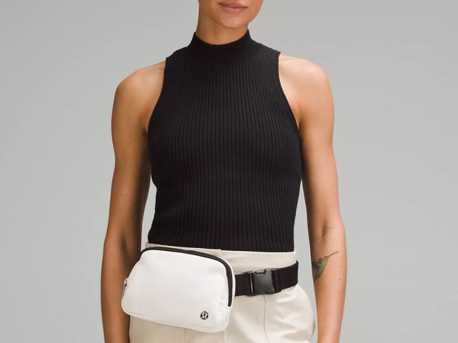 Stock image of a woman wearing a lululemon everywhere belt bag on her waist
