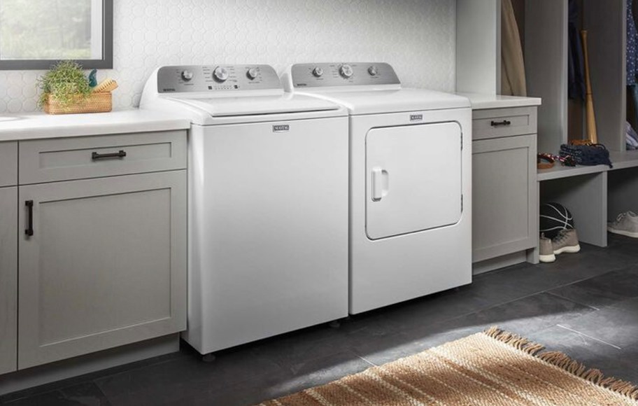 white washer and dryer in laundry room 