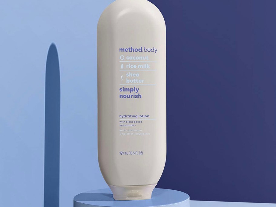 method body lotion bottle sitting on blue table