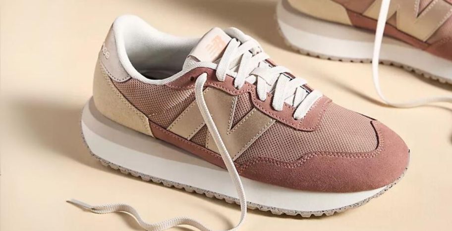 a womans copper colored new balance sneaker