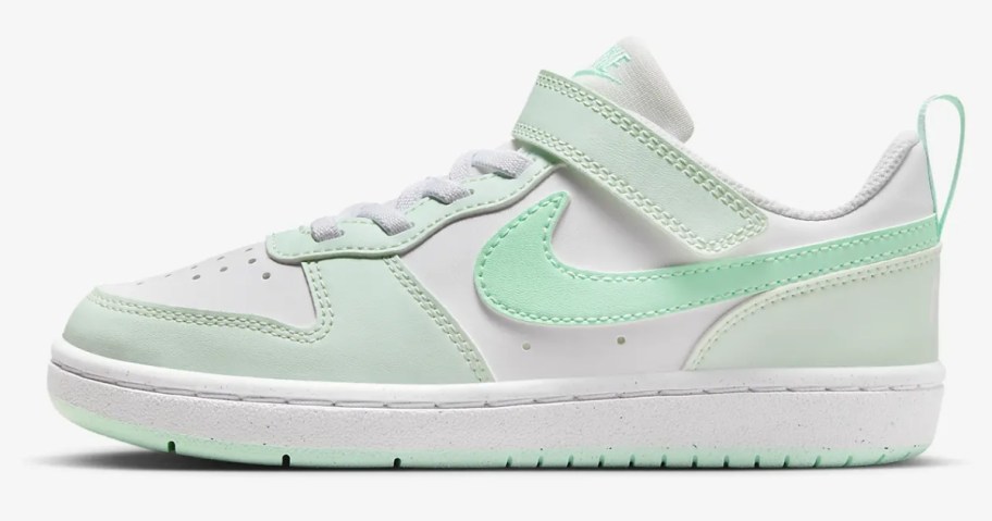 light green and white little kid's Nike court shoe