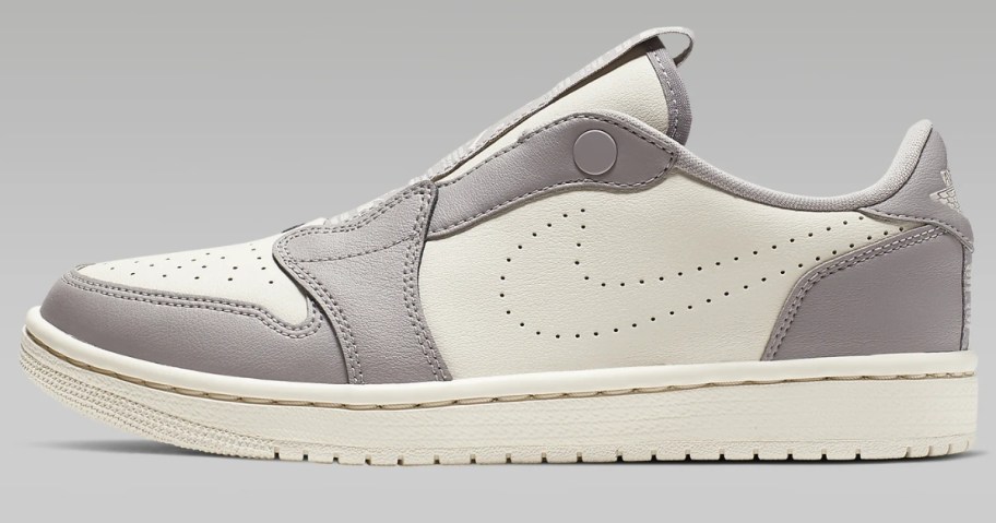 white and grey women's low top Nike Jordan shoe
