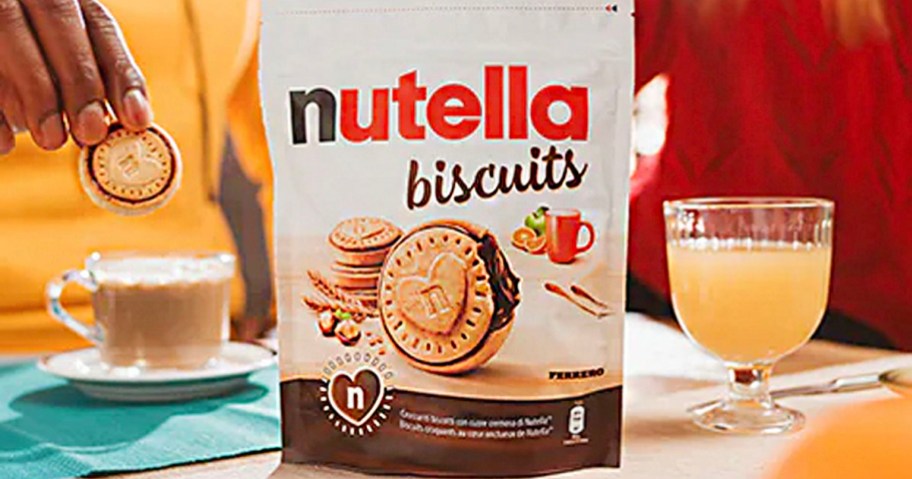 bag of nutella biscuits on table with drinks behind it