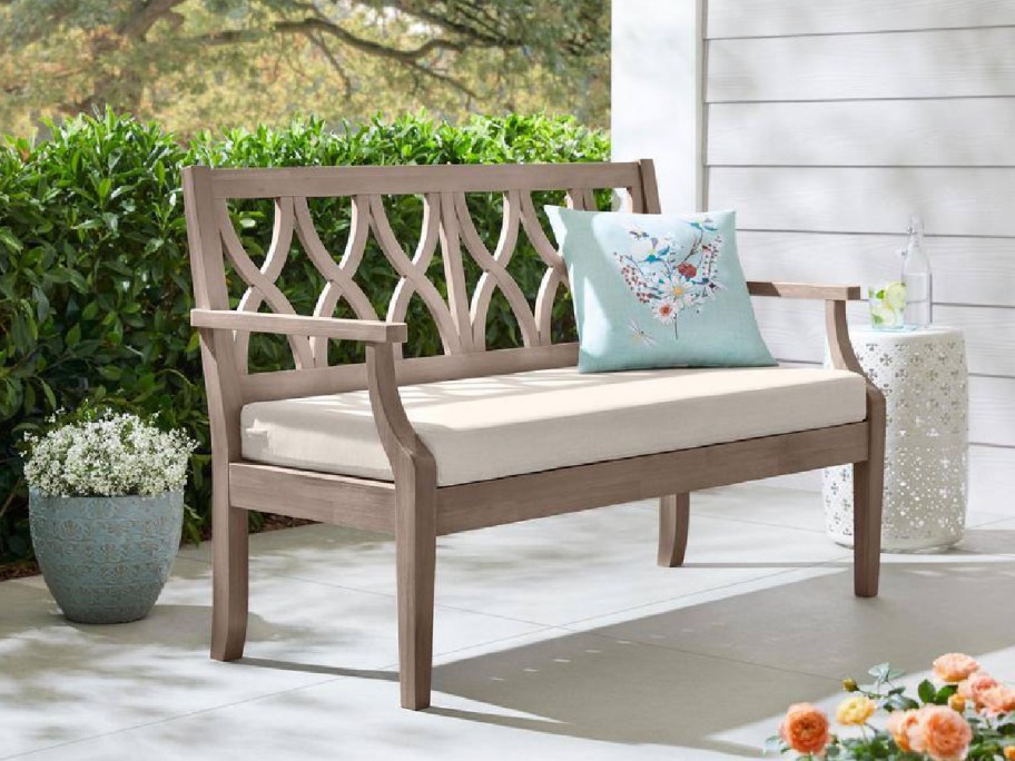 outdoor patio bench shown with cushion