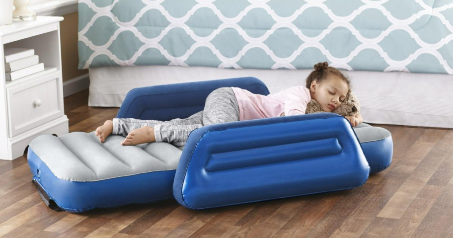 little girls sleeping on an ozark trail kids air mattress next to a bed