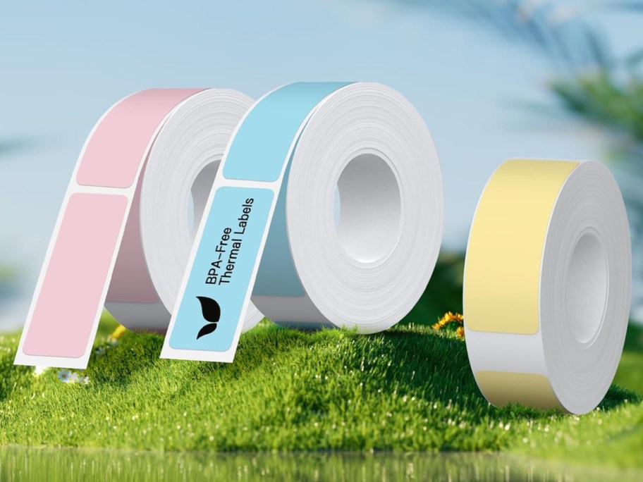 pink blue and yellow tape displayed on the grass