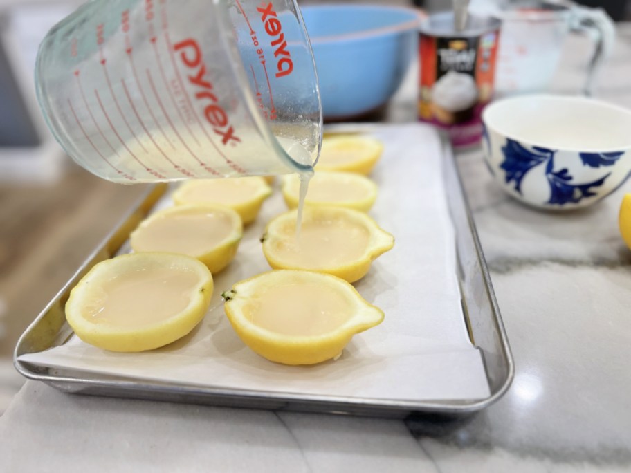 pouring sorbet into lemon cups