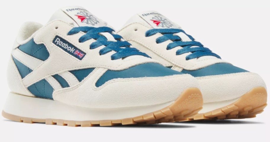 white and teal kid's classic Reebok shoes