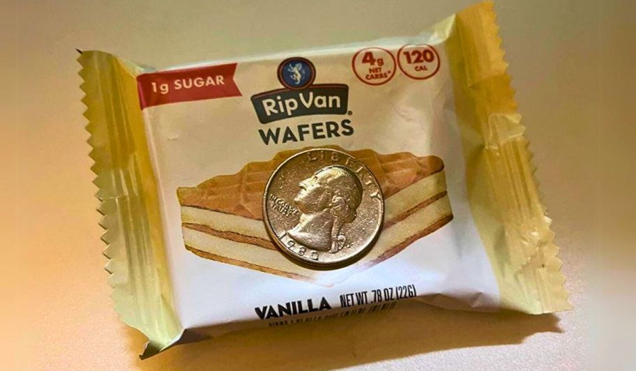 womans hand holding a package of rip van vanilla keto wafers