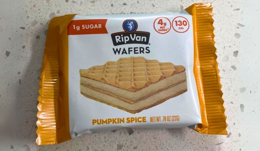 womans hand holding a package of rip van pumpkin spice keto wafers