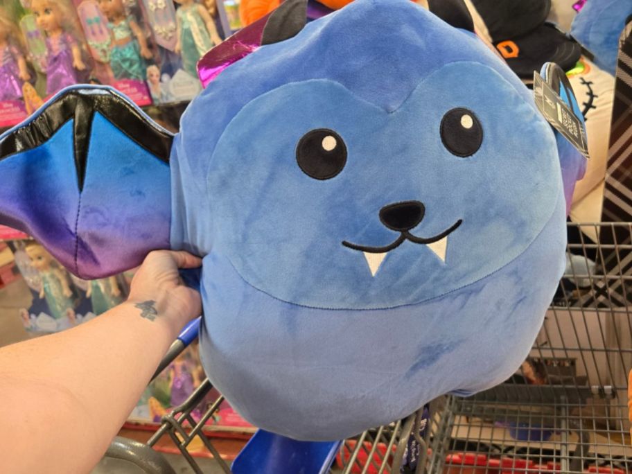 Halloween Secret Pocket Plush bat in hand in store