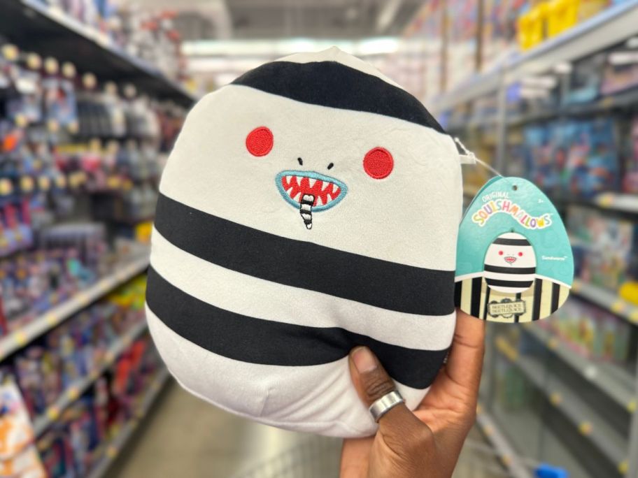 Squishmallows 8-Inch Sandworm in hand in store