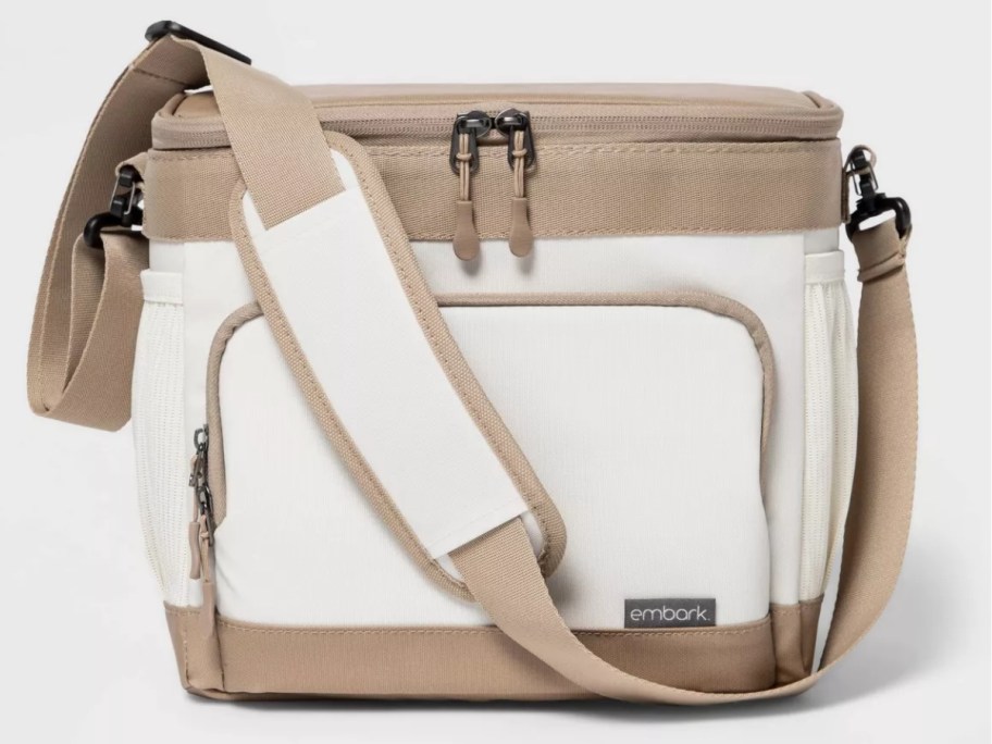 white and tan soft sided cooler with carry strap