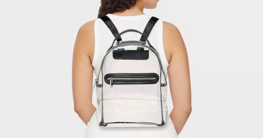 woman wearing clear backpack