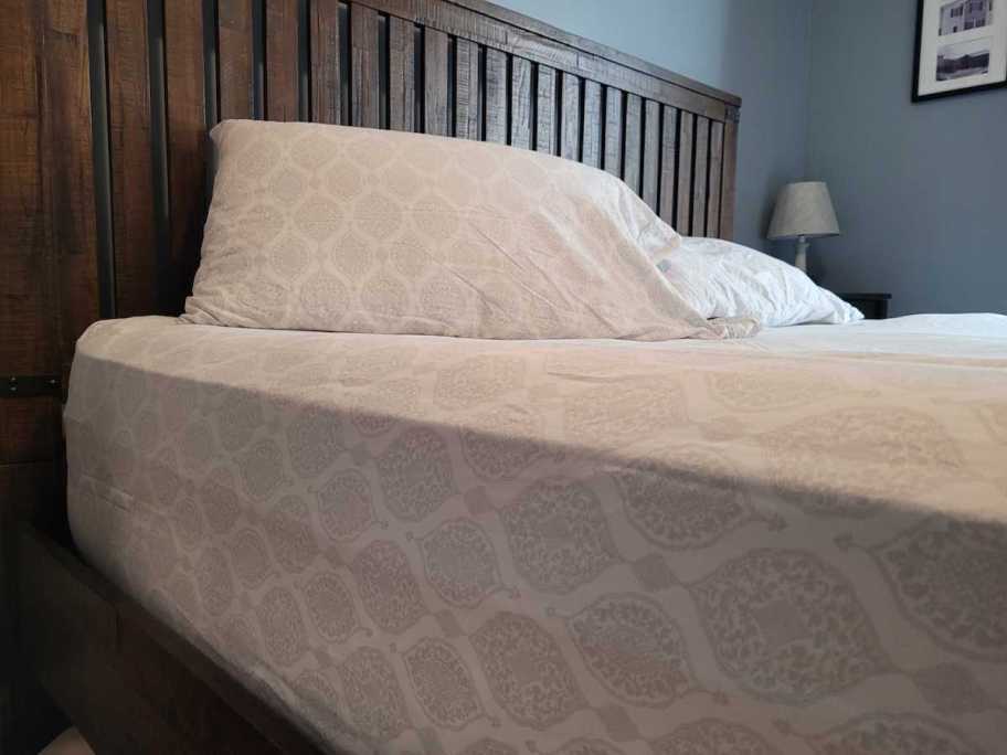 close up of paisley sheets on bed 