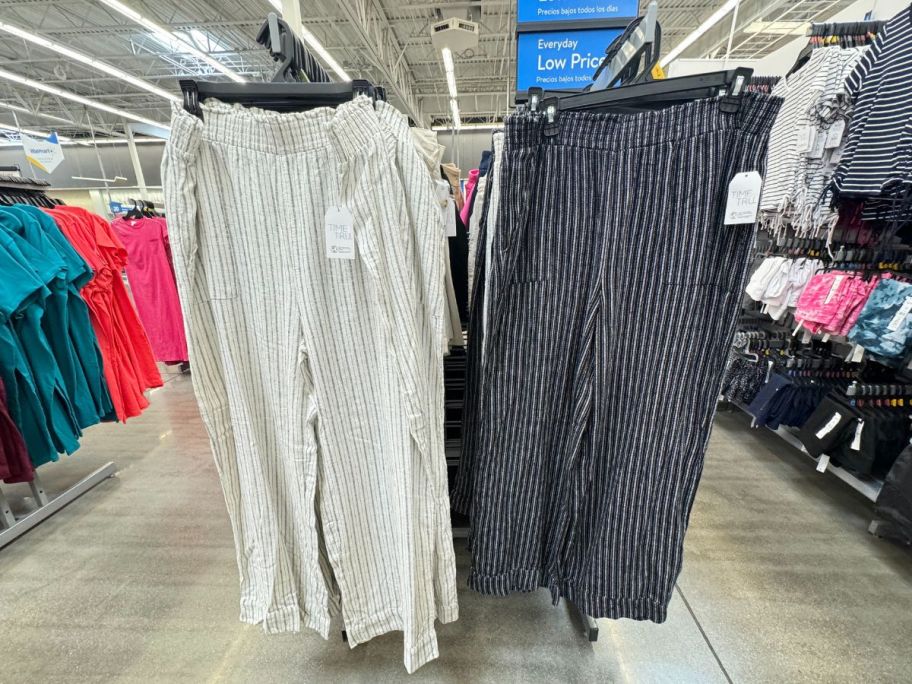 two pair of time and tru womens linen pants hanging on a clothing rack in a walmart store