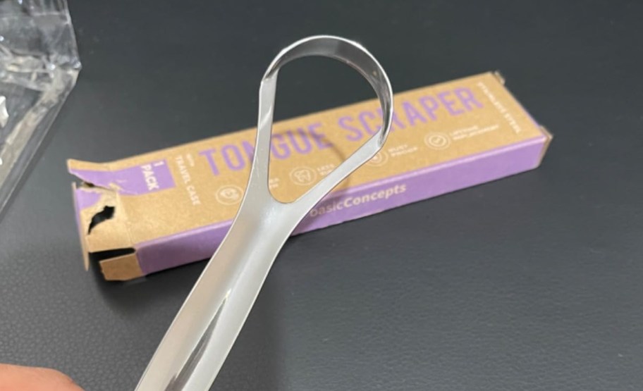 tongue scraper with its box behind it