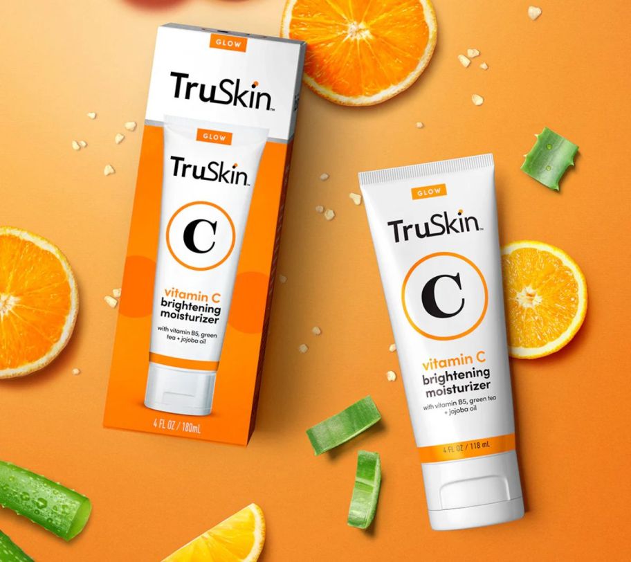 a tube of tru skin vitamin c moisturizer stock image on an orange background