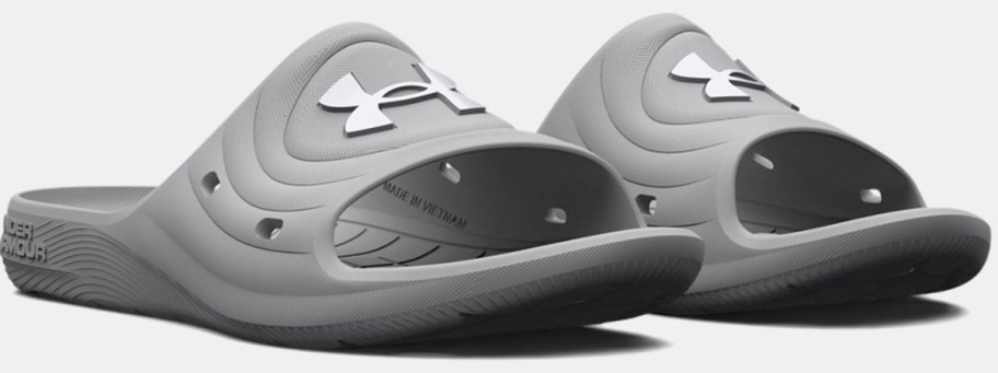 gray and white under armour slides