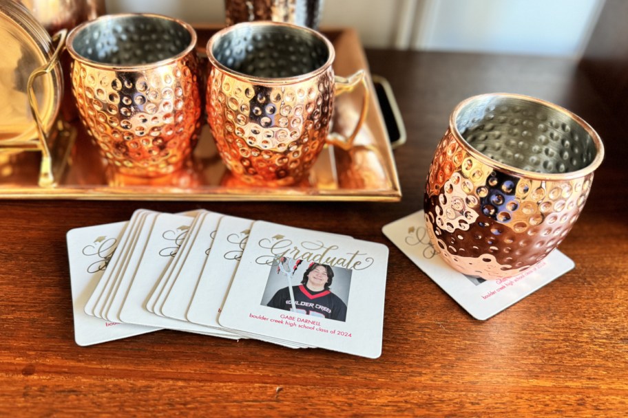 photo coasters with graduate photo next to tumblers