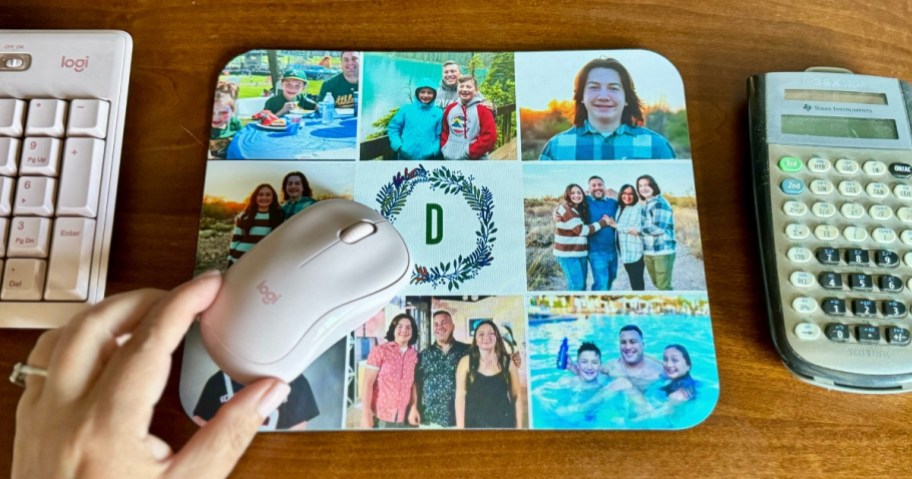 person's hand on a computer mouse that's on a custom photo mousepad
