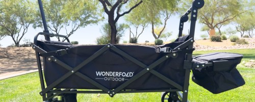 black folding wagon on grass