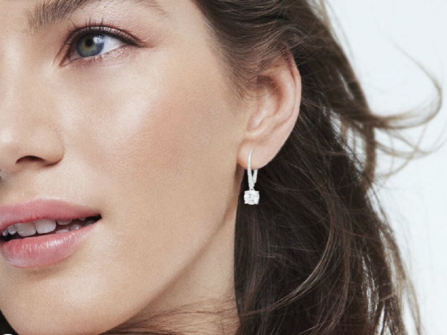 woman wearing White Lab-Created Sapphire Drop Earrings in Sterling Silver
