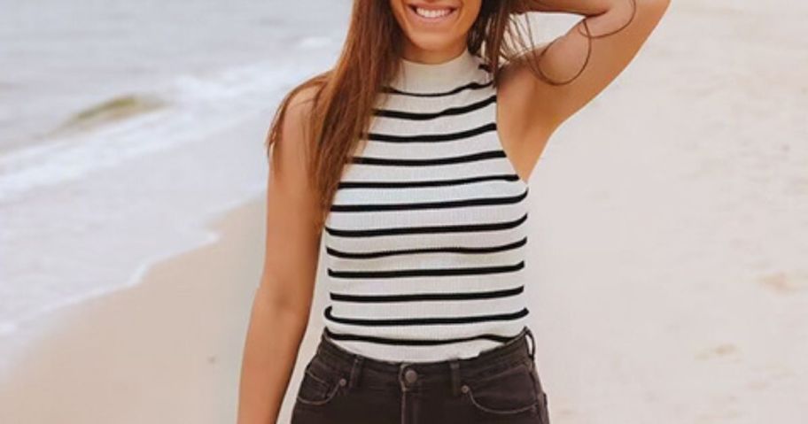 woman wearing ZESICA Womens Ribbed Tank Tops High Neck Slim Fitted Striped Basic Casual Summer Sleeveless Shirts on beach