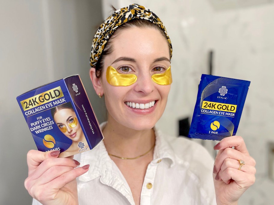 woman holding gold eye masks 