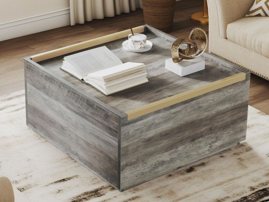 large grey rustic look square coffee table in a living room