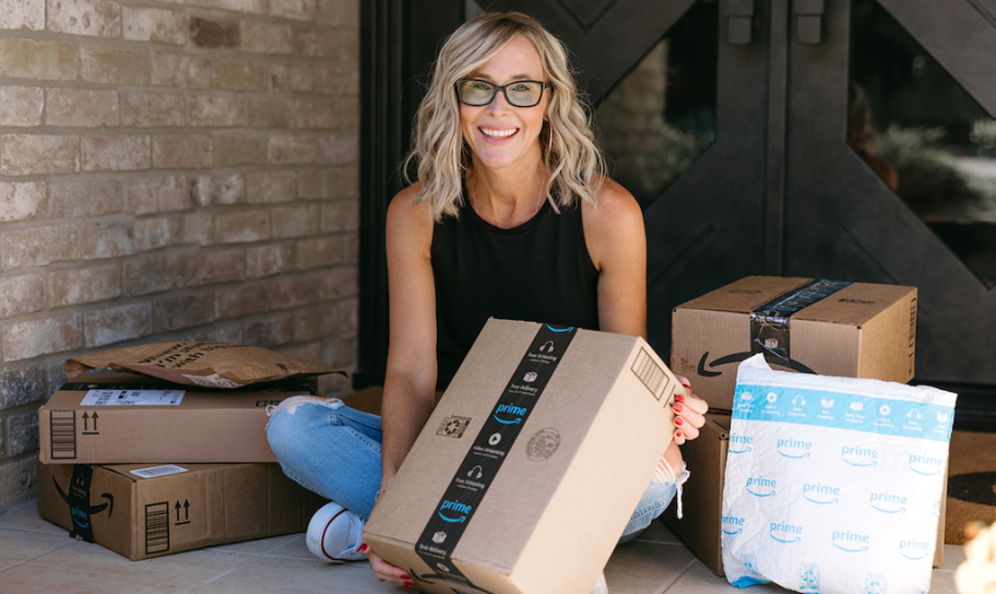 woman with Amazon packages on porch