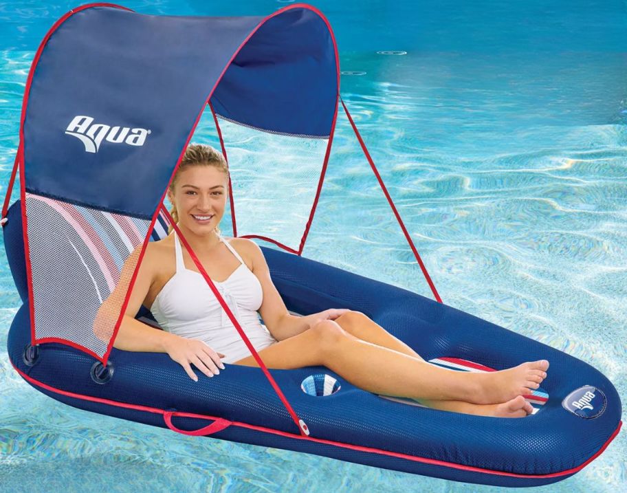 a woman reclining in a shades pool float