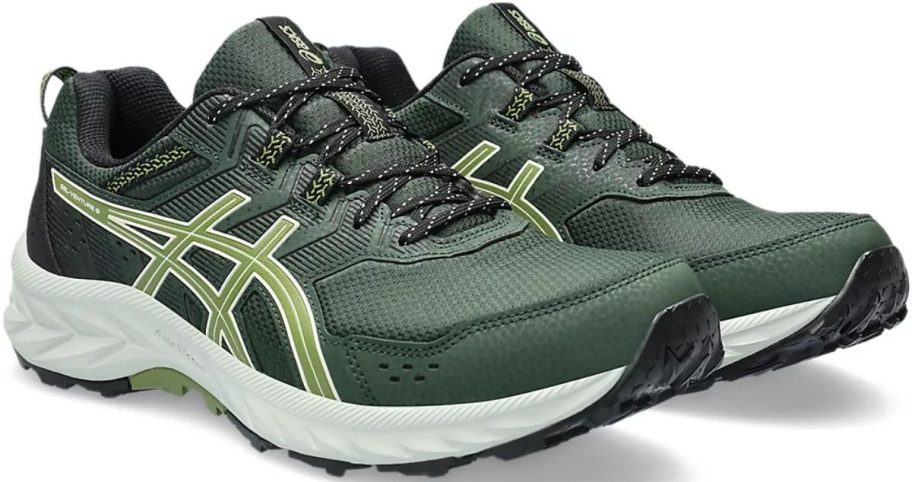 a dark green pair of mens running shoes