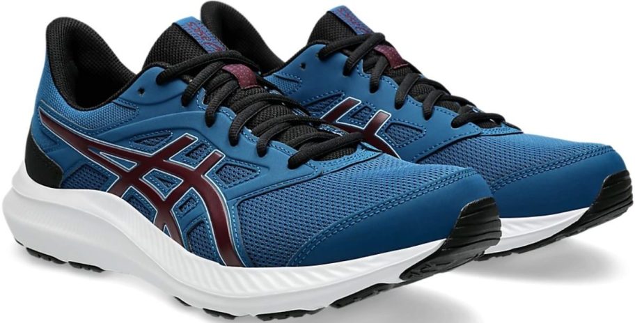 a teal blue pair of mens running shoes