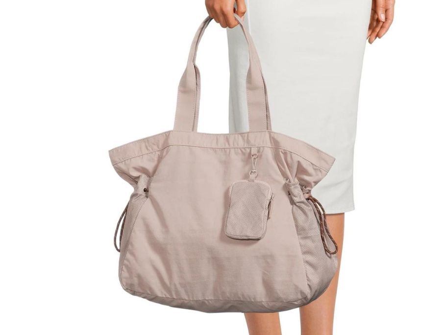 woman holding Athletic Works Women's Nylon Tote