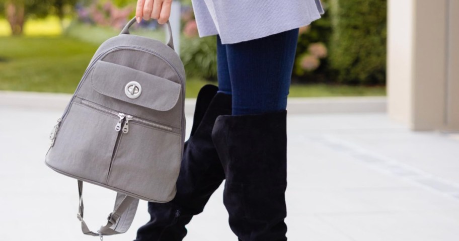 woman carrying gray Baggallini Convertible Backpack