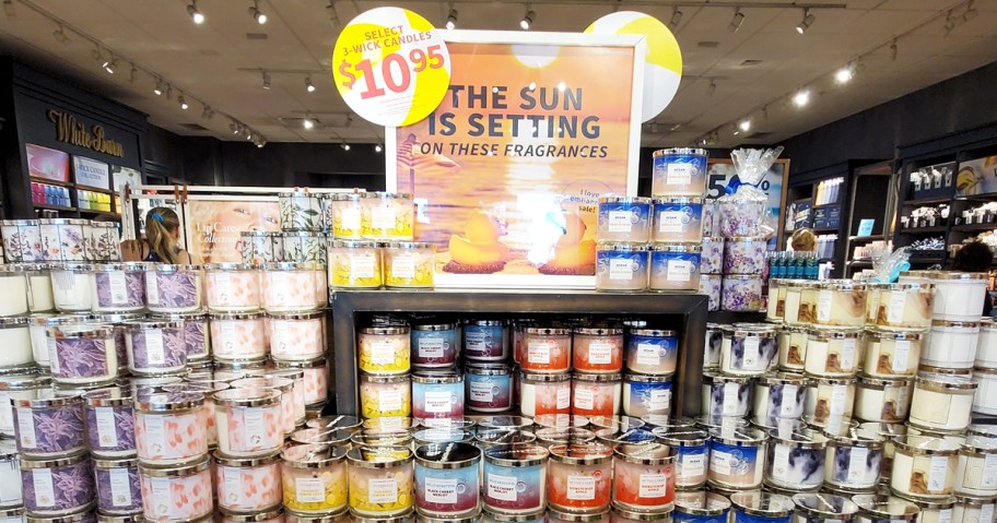 display of 3-wick candles with $10.95 semi-annual sale signage