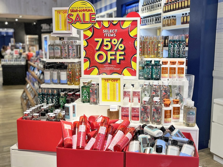 display of body care items in red boxes with 75% off sale sign
