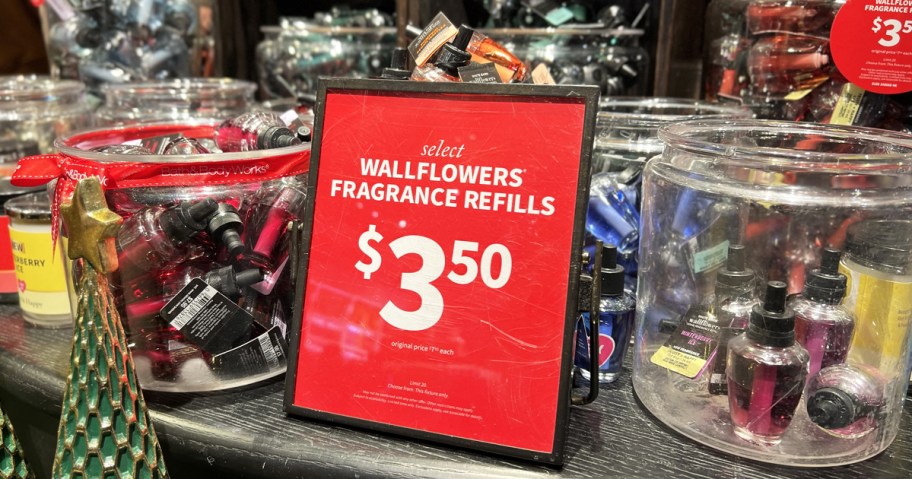 red $3.50 sale sign in front of jars of Bath & Body Works Wallflowers Fragrance Refills
