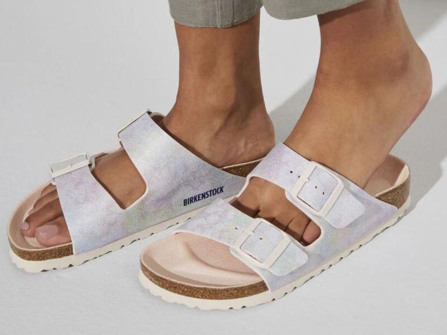 A woman wearing Birkenstock Arizona Sandal in Iridescent Rose