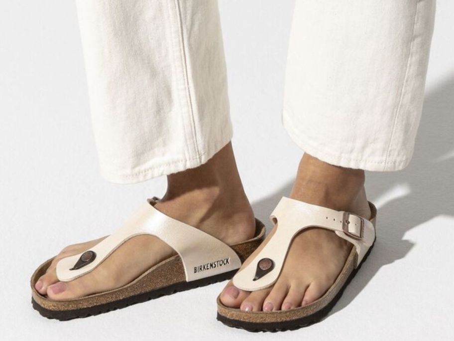 Woman's feet wearing Birkenstock Gizeh sandals