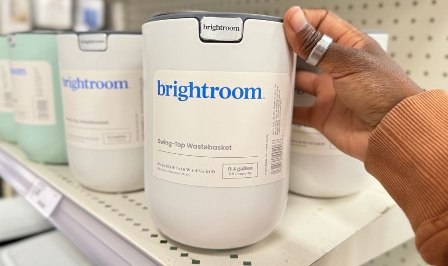 a small white round desktop trash can