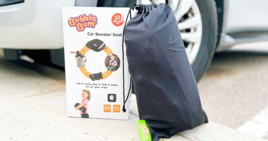 Bubble Bum Booster Seat deflated in the carry bag next to the box