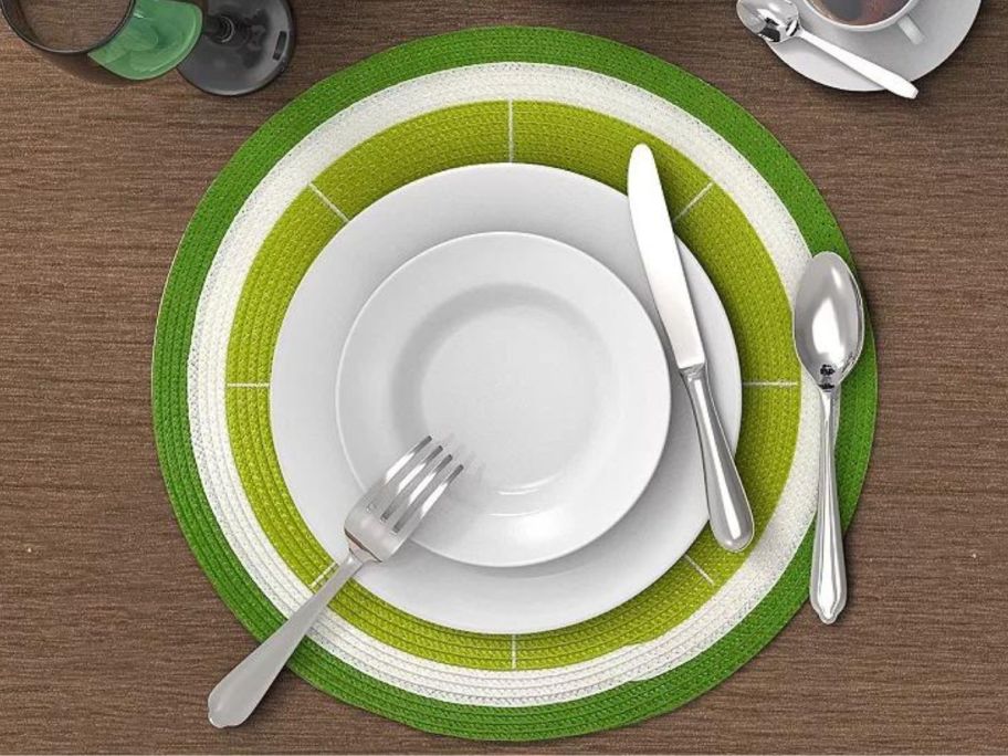A place setting with a lime shape placemat under it